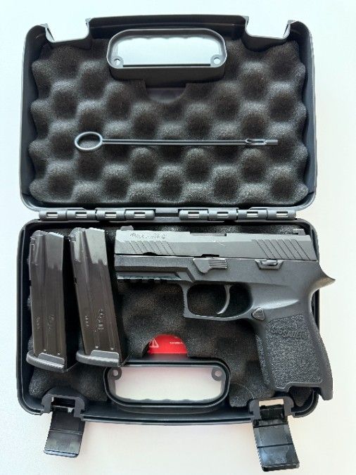 Sig P320 9mm w/ case and 2 mags